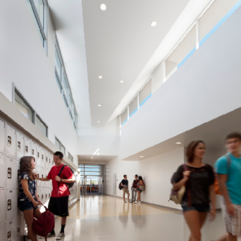 an image of students walking down a hall
